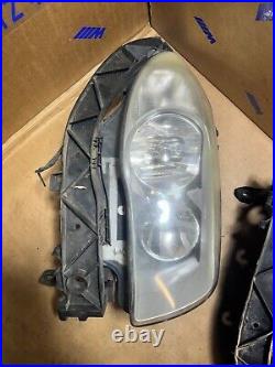 Bmw e87 one series pair of headlights wth brackets & wire loom clips connectors